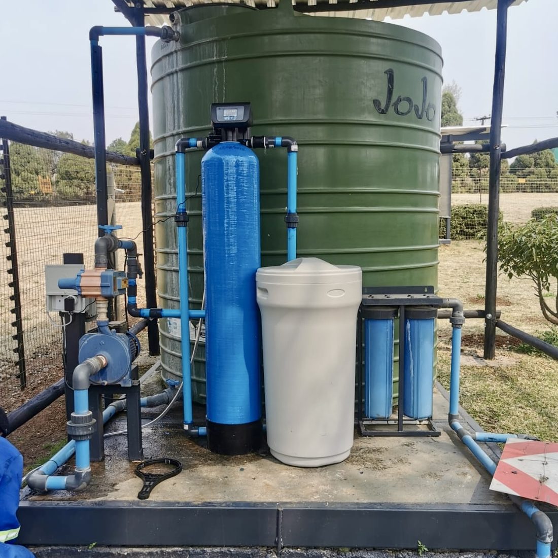 Custom water treatment setup with JoJo tank, filtration and pump system